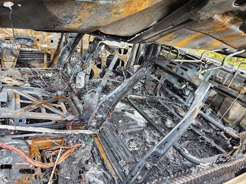 Photo of the burned out vehicle from collision on May 7