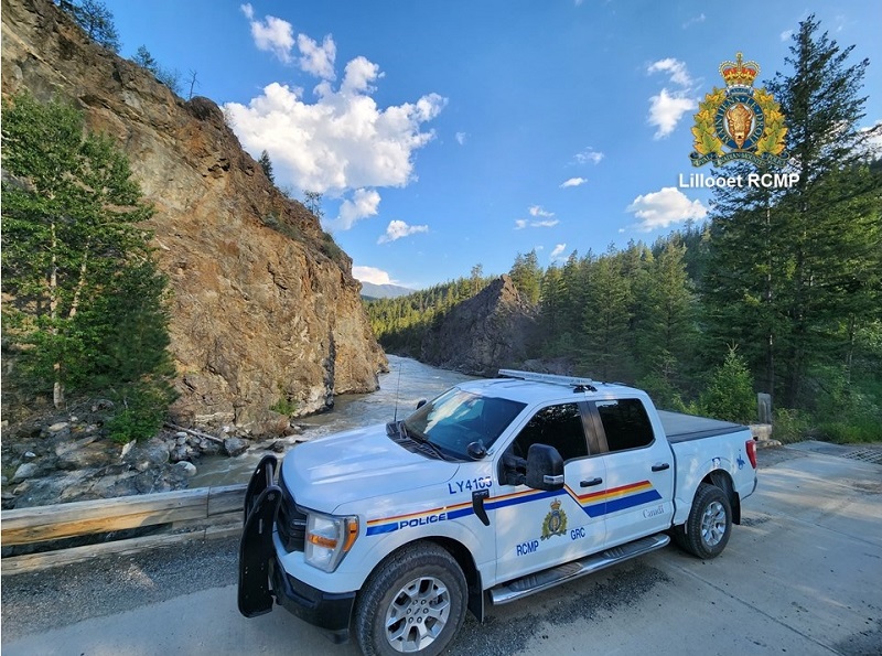 View of RCMP police vehicle with river in background