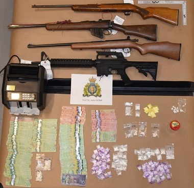 Weapons, money and suspected drugs